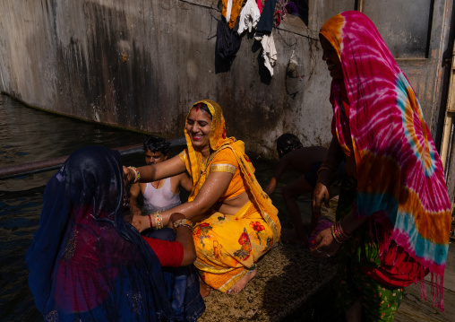 Indian pilgrims having a bath in Galtaji temple aka monkey temple, Rajasthan, Jaipur, India
