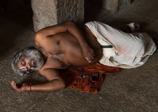 Priest slepping inside Sri Ranganathaswamy Temple, Tamil Nadu, Tiruchirappalli, India