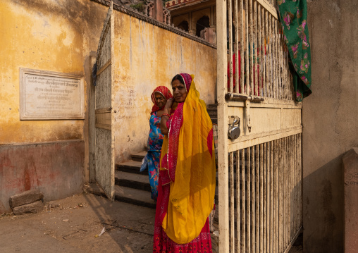 Indian women in traditional clothing in Galtaji monkey temple, Rajasthan, Jaipur, India