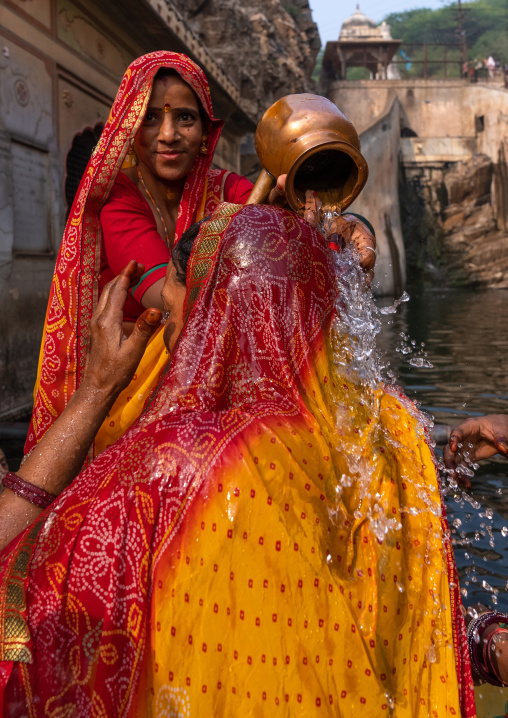 Indian pilgrims having a bath in Galtaji temple aka monkey temple, Rajasthan, Jaipur, India