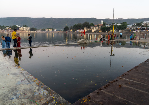 Indian pilgrims in Barhama lake and bathing ghats, Rajasthan, Pushkar, India