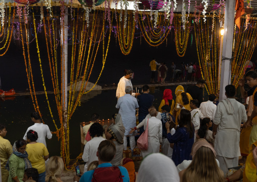 Indian people praying at night on the ghats, Rajasthan, Pushkar, India