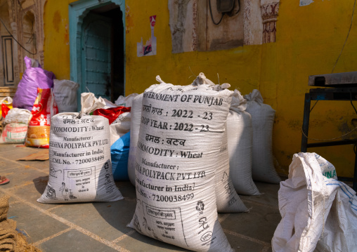Bags of wheat in front of a store, Rajasthan, Mahansar, India