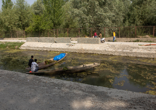 Indian men cleaning a canal, Jammu and Kashmir, Srinagar, India