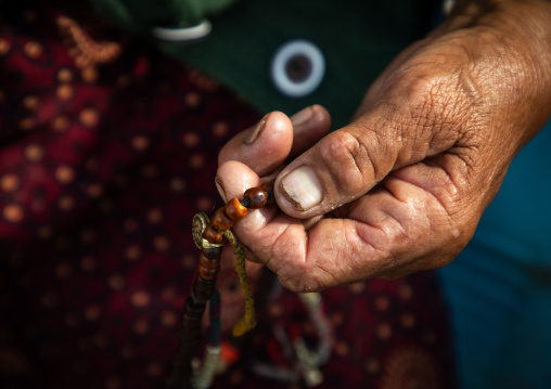 Buddhist hand with a payer beads, Ladakh, Leh, India