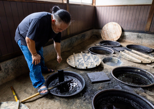 Kurume Kasuri indigo dyeing process in Aika Tanaka Kasuri Kobo workshop, Kyushu region, Chikugo, Japan