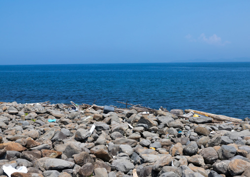 Trashes on a rocky beach, Ainoshima Island, Shingu, Japan