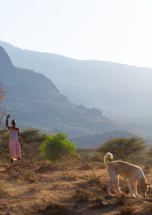 Samburu woman with her dog, Marsabit District, Ngurunit, Kenya