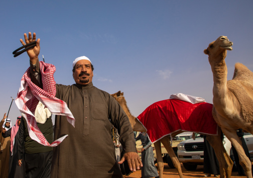Saudi men dancing during King Abdul Aziz Camel Festival, Riyadh Province, Rimah, Saudi Arabia
