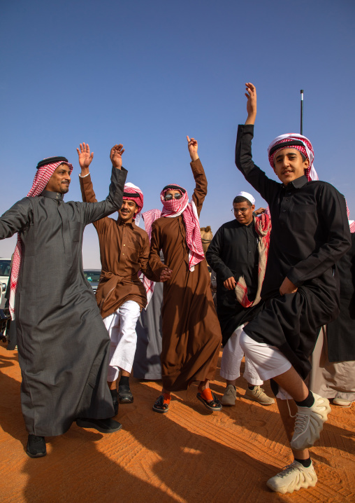 Saudi men dancing during King Abdul Aziz Camel Festival, Riyadh Province, Rimah, Saudi Arabia