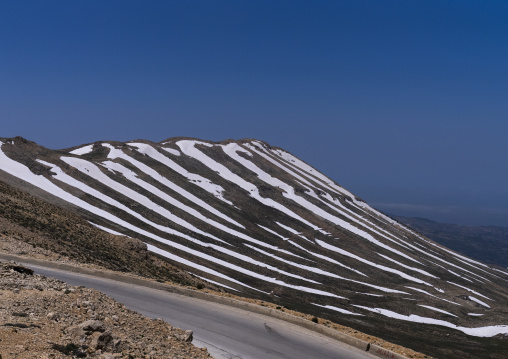 Road in the mountain with patches of snow, North Governorate, Daher el Kadib, Lebanon