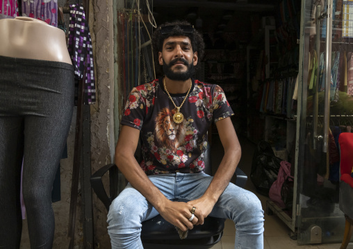 Fashionnable man sit in front of a shop, North Governorate, Tripoli, Lebanon