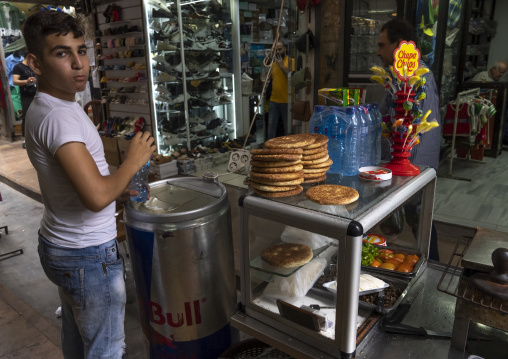 Boy selling lebanese food in the souk, North Governorate, Tripoli, Lebanon