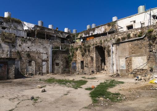 Courtyard of an old caravanserai occupied by poor people, North Governorate, Tripoli, Lebanon