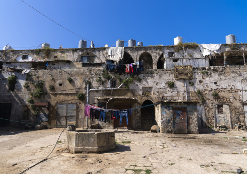 Courtyard of an old caravanserai occupied by poor people, North Governorate, Tripoli, Lebanon
