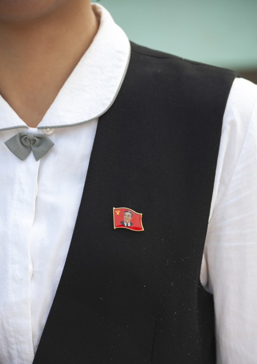 North korean woman with a Kim Il Sung badge, DGC, Pyongyang, North Korea