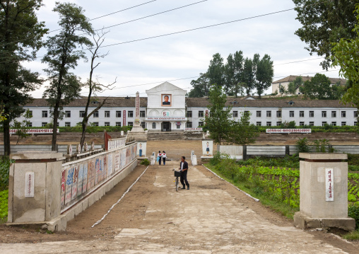 School with propaganda billboards, North Hwanghae, Kaesong, North Korea