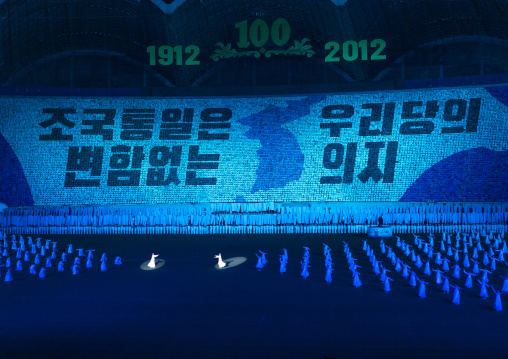 Children holding up boards about reunification during Arirang, DGC, Pyongyang, North Korea