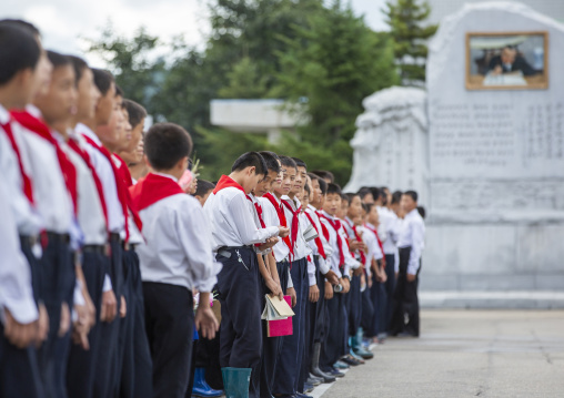North Korean pioneers paying respect to the Leaders in Mansudae art studio, DGC, Pyongyang, North Korea