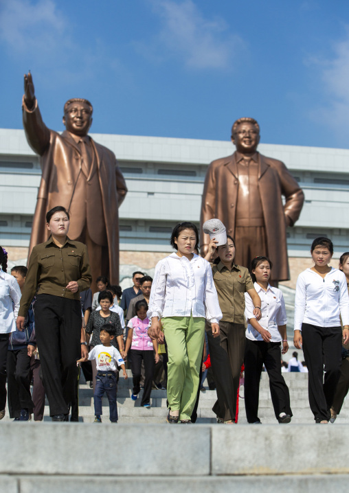 People in front of the statues of the Leaders in Mansudae Grand monument, DGC, Pyongyang, North Korea