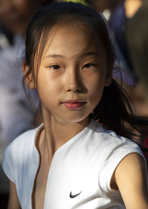 North Korean girl dancing in a park on september 9, DGC, Pyongyang, North Korea