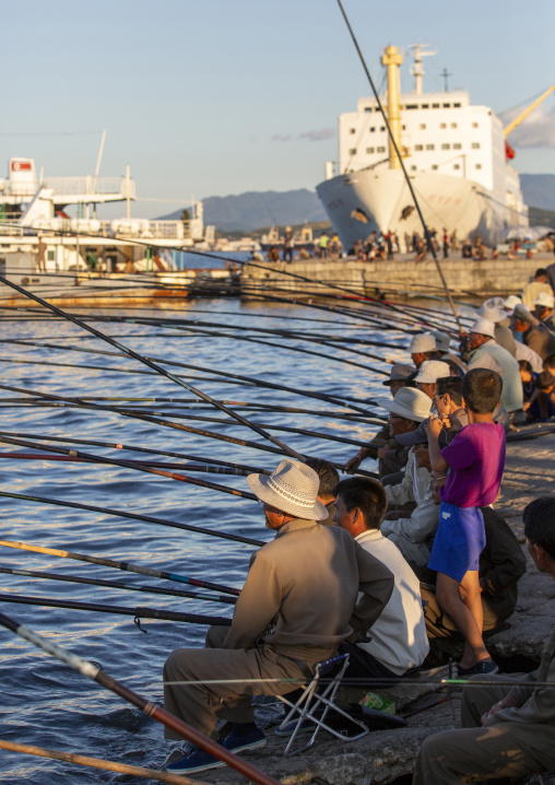 North Korean men fishing in the port, Kangwon Province, Wonsan, North Korea