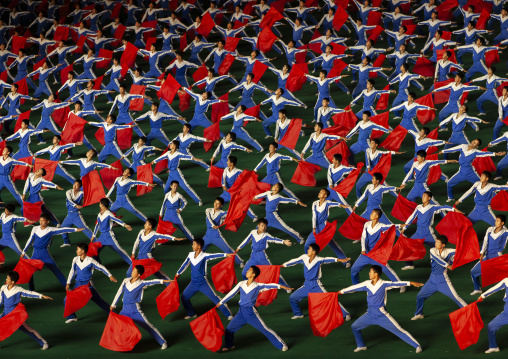 North Korean gymnasts with red flags during the Arirang mass games, DGC, Pyongyang, North Korea