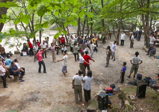 North Korean electricity company workers dancing in a park, North Hwanghae, Kaesong, North Korea