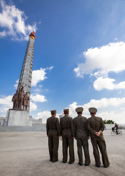 Soldiers in front of the Juche tower, DGC, Pyongyang, North Korea