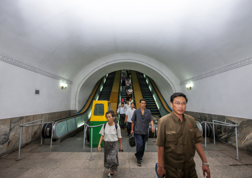North Korean people using escalator leading to the subway station, DGC, Pyongyang, North Korea
