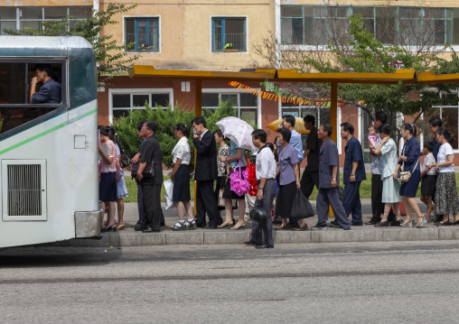 North Korean people queueing to take the bus, DGC, Pyongyang, North Korea