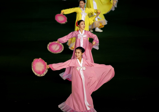 Women dancing in choson-ot during the Arirang mass games, DGC, Pyongyang, North Korea