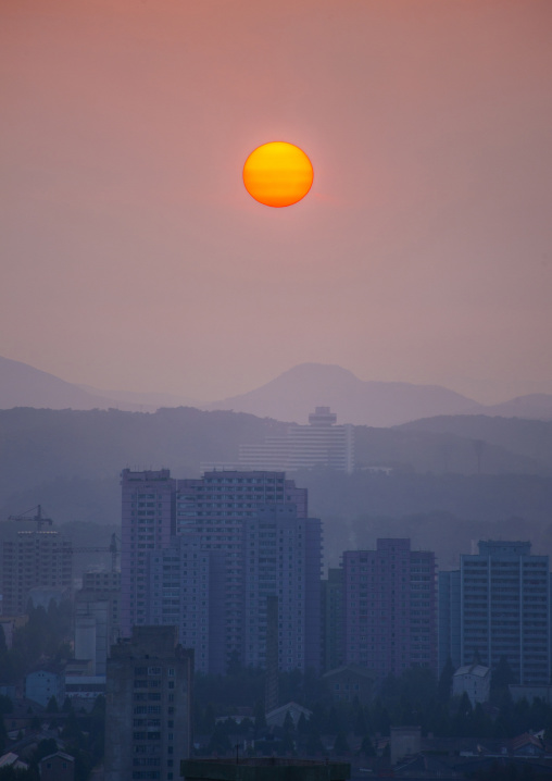 Sunset over the city buildings, DGC, Pyongyang, North Korea