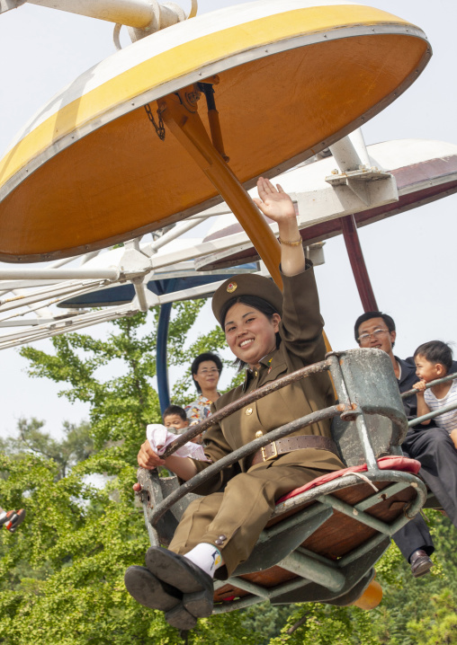 North Korean female soldier on an attraction in Taesongsan funfair, DGC, Pyongyang, North Korea