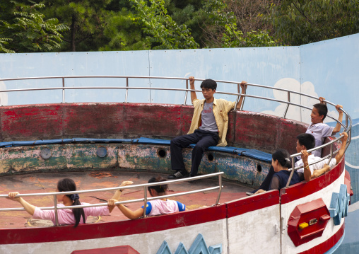 North Korean people enjoying an attraction in Taesongsan funfair, DGC, Pyongyang, North Korea
