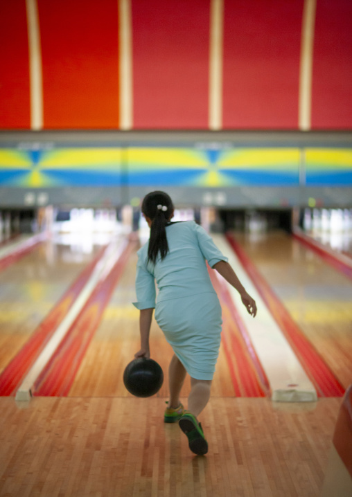 North Korean woman playing bowling, DGC, Pyongyang, North Korea