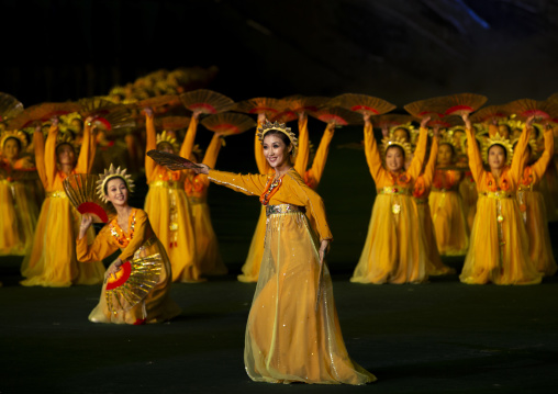 Women dancing in choson-ot during the Arirang mass games, DGC, Pyongyang, North Korea
