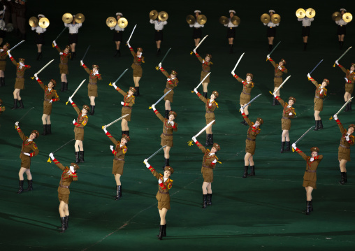 North Korean women dressed as soldiers dancing with swords in Arirang, DGC, Pyongyang, North Korea