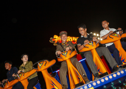 North Korean soldiers in a fairground attraction at Kaeson youth park, DGC, Pyongyang, North Korea