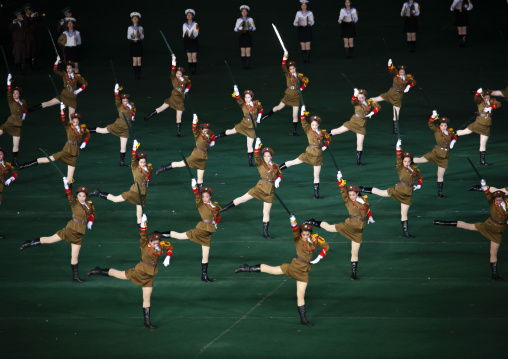 North Korean women dressed as soldiers dancing with swords during Arirang, DGC, Pyongyang, North Korea