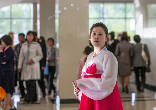 North Korean woman in traditional choson-ot in opera lobby, DGC, Pyongyang, North Korea