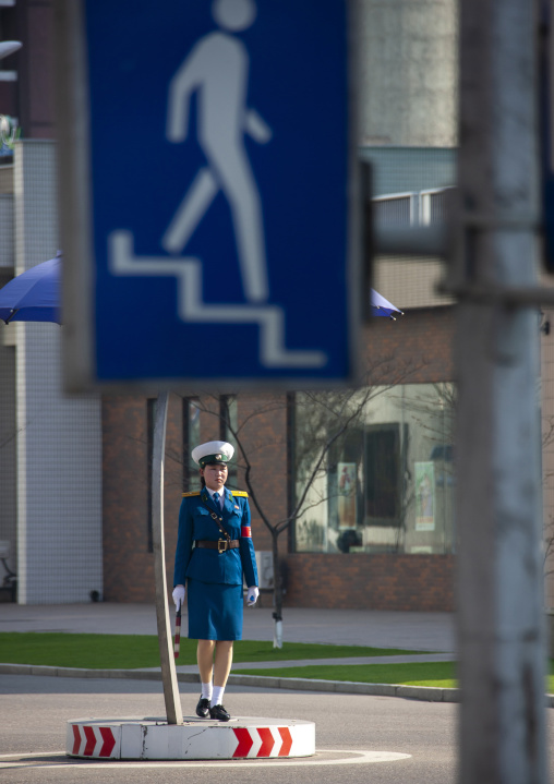 North Korean traffic security officer in blue uniform in the street, DGC, Pyongyang, North Korea