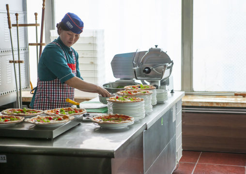 North Korean pizzeria cook in an italian restaurant, DGC, Pyongyang, North Korea