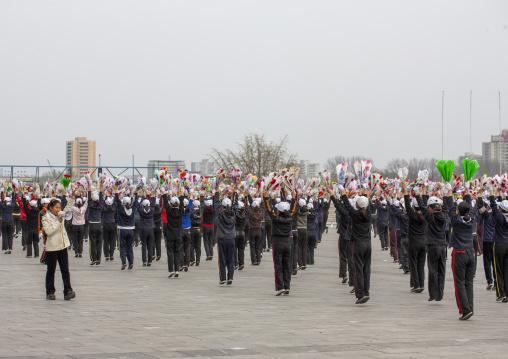 Young women during a mass games rehearsal in Kim il Sung square, DGC, Pyongyang, North Korea