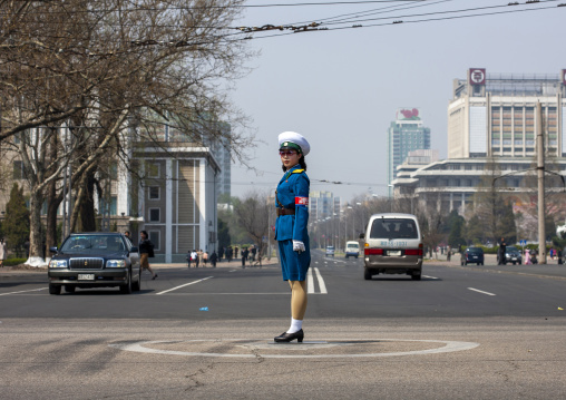 North Korean female traffic security officer in blue uniform in the street, DGC, Pyongyang, North Korea