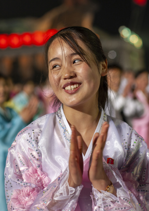 Woman dancing to celebrate april 15 the birth anniversary of Kim Il-sung, DGC, Pyongyang, North Korea