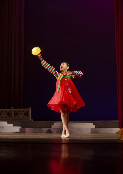 North Korean acrobat girl on the stage of Mangyongdae children's palace, DGC, Pyongyang, North Korea