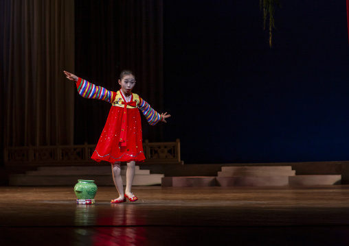 Acrobat girl with a pottery on the stage of Mangyongdae children's palace, DGC, Pyongyang, North Korea