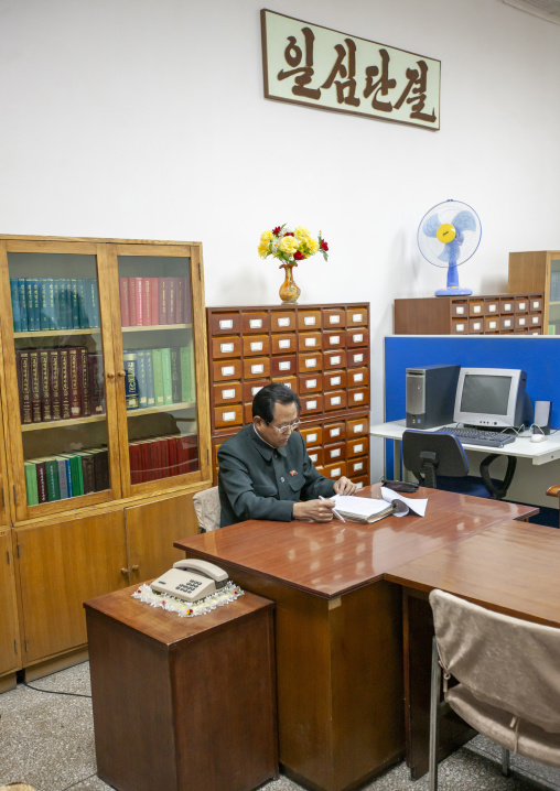 Expert who answers questions of the visitors in the Grand people's study house, DGC, Pyongyang, North Korea
