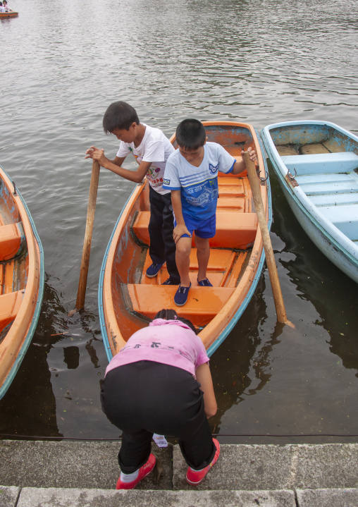 North Korean pioneers in a rowing boat, Kangwon Province, Wonsan, North Korea